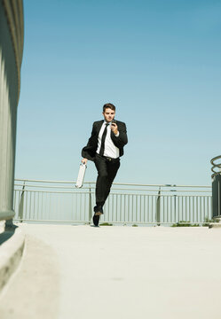 Businessman making Phone Call while Running, Mannheim, Baden-Wurttemberg, Germany