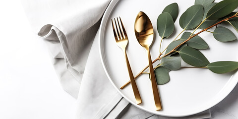 The gold cutlery on white plate were decorated with eucalyptus branches - generative ai