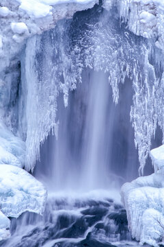 Icy crust formation over the Undine Falls in winter; Yellowstone National Park, United states of America