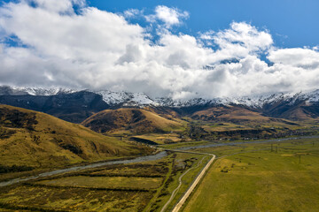 breathtaking view of snow-capped mountains from a drone in summer