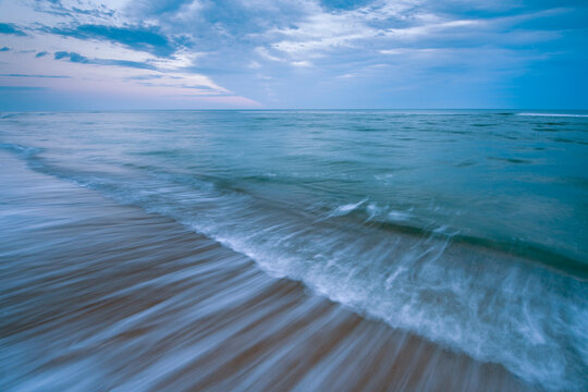 Surf flowing onto a beach at dawn, Marconi Beach in Welfleet, Massachusetts, USA; Massachusetts, United States of America