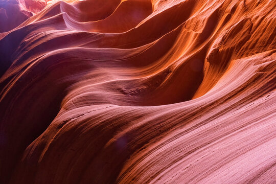 Slot canyon near Page, Arizona. The wind and water create amazing striations in the sandstone in a stunning example of erosion; Page, Arizona, United States of America