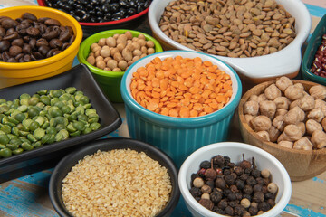 assorted bowls with raw grain and seeds top view