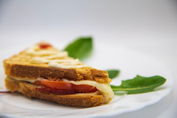 Sandwich with ham, cheese, tomatoes, and toasted bread...homemade sandwiches on white background...