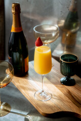 Mimosa with Strawberry Garnish in Decorative Setting