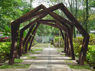 a unique construction with an abstract concept that is shaped like an alley on a path in a park