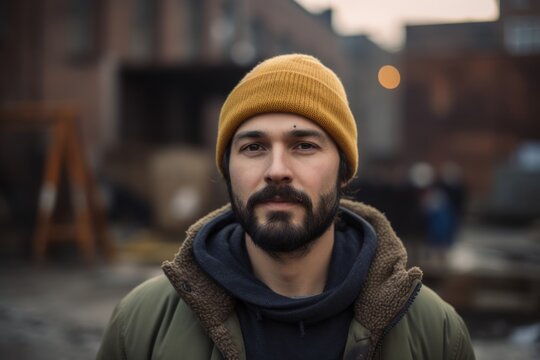 young handsome bearded hipster man outdoors in the city, lifestyle people concept