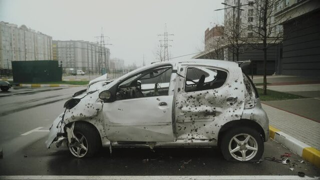 Shot holes in the body of a civilian car. Ukraine. Bucha 2022.