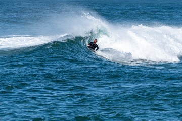Obraz premium Bodyboarder surfing ocean wave