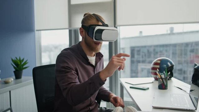 Futuristic streamer playing metaverse at flat closeup. Vr glasses man exploring