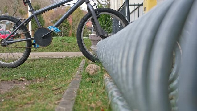 Kid Bike Parked at Bikestand by School Building
