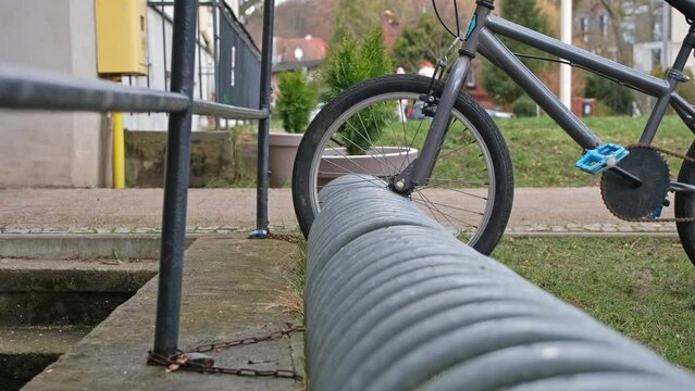 Kid Bike Parked at Bikestand by School Building