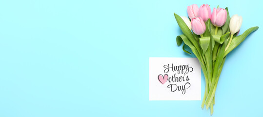 Card with text HAPPY MOTHER'S DAY and tulips on light blue background with space for text
