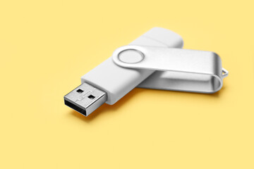 Open USB flash drive on yellow background