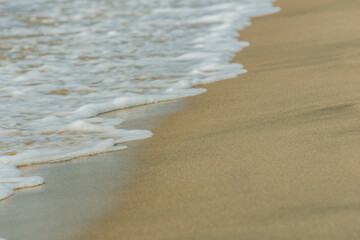 waves on the beach sand texture background