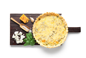 Board with delicious quiche, cheese and spinach leaves isolated on white background