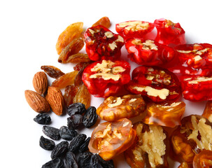 Delicious churchkhela, walnuts, almonds and raisins isolated on white background