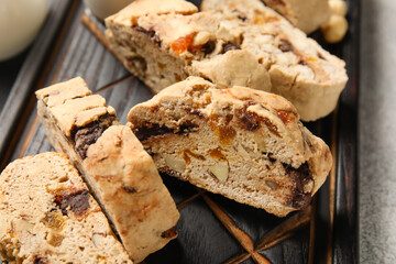 Board with delicious biscotti cookies, closeup
