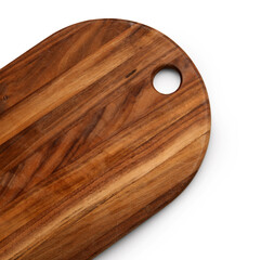New wooden kitchen board on light background, closeup
