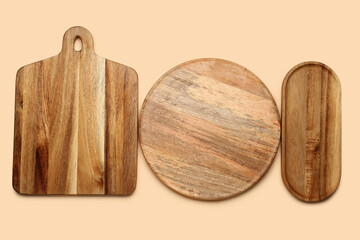 Different wooden boards on color background