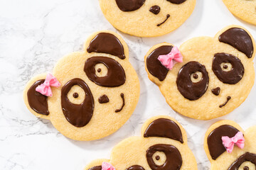 Panda shaped shortbread cookies with chocolate icing