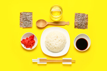 Composition with ingredients for preparing tasty sushi rolls on yellow background