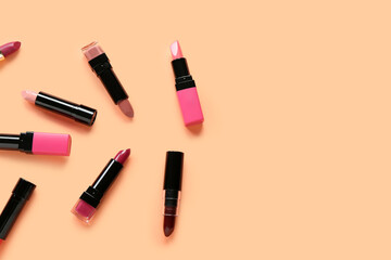 Obraz premium Set of different lipsticks on color background