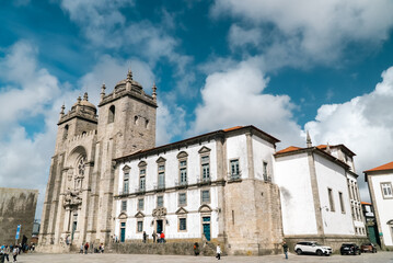 Fototapeta na wymiar Oporto, Portugal. April 12 , 2022: Pelourinho and Porto Cathedral with facade and blue sky.