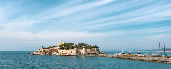 Kusadasi, Turkey: Kusadasi castle and sea on a sunny day