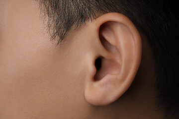 Closeup view of man, focus on ear