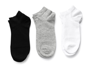 Different pairs of socks isolated on white, top view