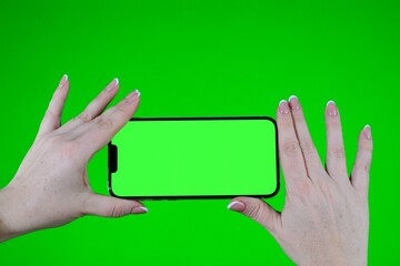 Scroll on Smartphone with Green Mock-up Screen Chroma Key. Phone green screen for product placement. Gestures on touch screen. High quality photo