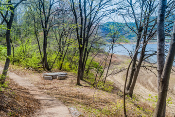 Marble picnic table at rural lakeside park.