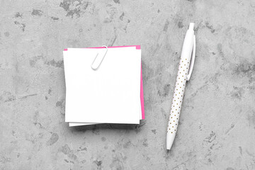 Composition with sticky notes and pen on grunge background