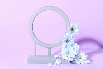 Decorative plaster frame with chrysanthemum flowers on lilac background