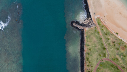 Top down aerial view of calm plain beach for background