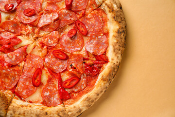 Delicious pepperoni pizza on orange background