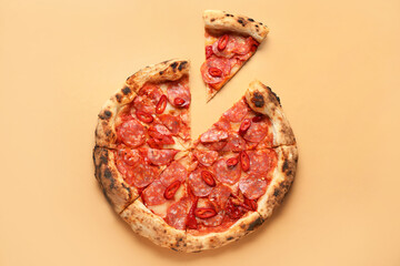 Delicious pepperoni pizza on orange background