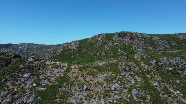 Drone flying around la curota near Ribeira Spain with mountain views