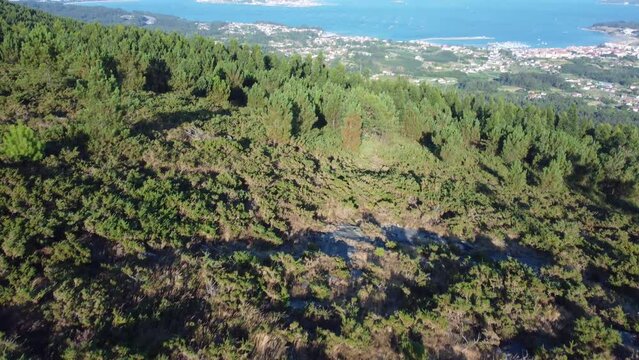 Pan up to ocean view of Ria de Arousa beautiful views on hike up la curota