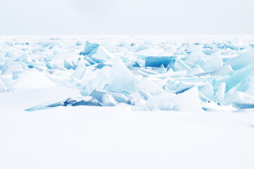 Hummocks under the snow on the ice of Lake Baikal
