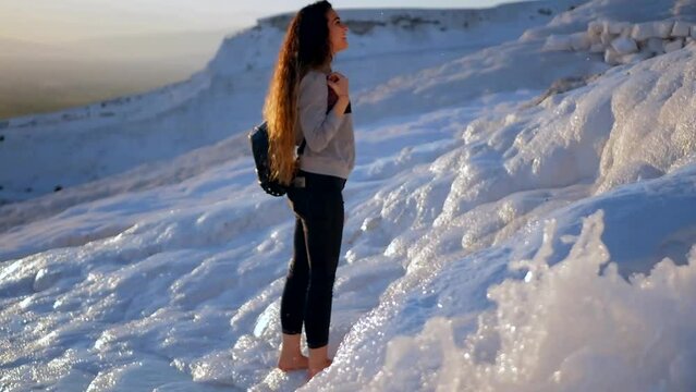 Young woman walking in Pamukkale terraces