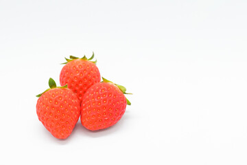 beautiful three fresh red strawberry isolated on white background