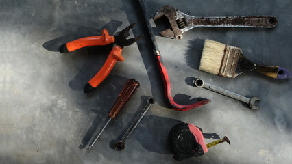 Set of assorted work tools. Various carpentry tools on wooden background.