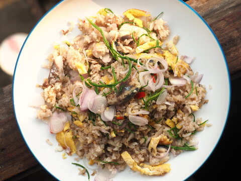 fried rice with egg, mackerel fish and Cha-om leaves or climbing wattle