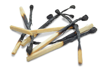 Several burnt matches randomly lying on a transparent background. The concept of a fire...