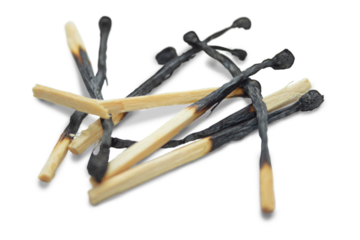 Several burnt matches randomly lying on a transparent background. The concept of a fire extinguishing system, security.