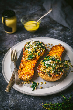 Stuffed Butternut Squash halves on plate side angle