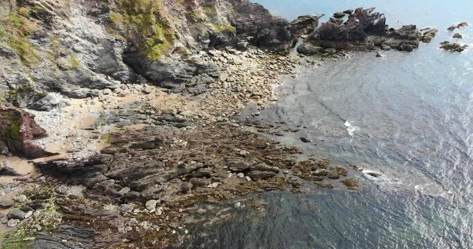 Rocky shoreline captured in Thurlestone, England Village. Stunning visuals of coastal landscape.