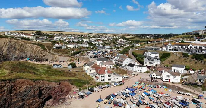 Aerial View Of Boats At Hope Cove Beach At Low Tide. Slow Descending Shot